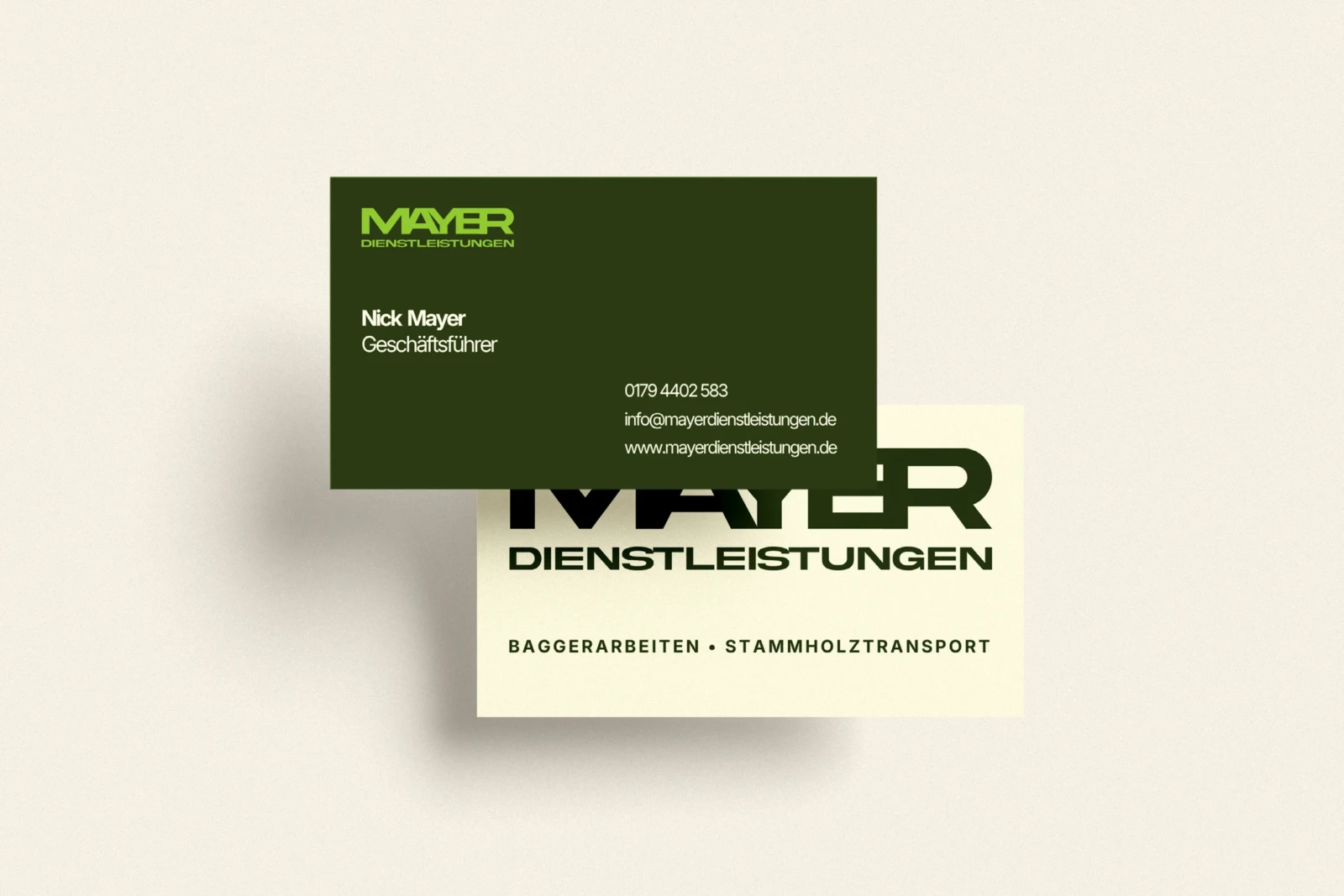 Original Mayer Dienstleistungen business-card design in forest green and off-white.